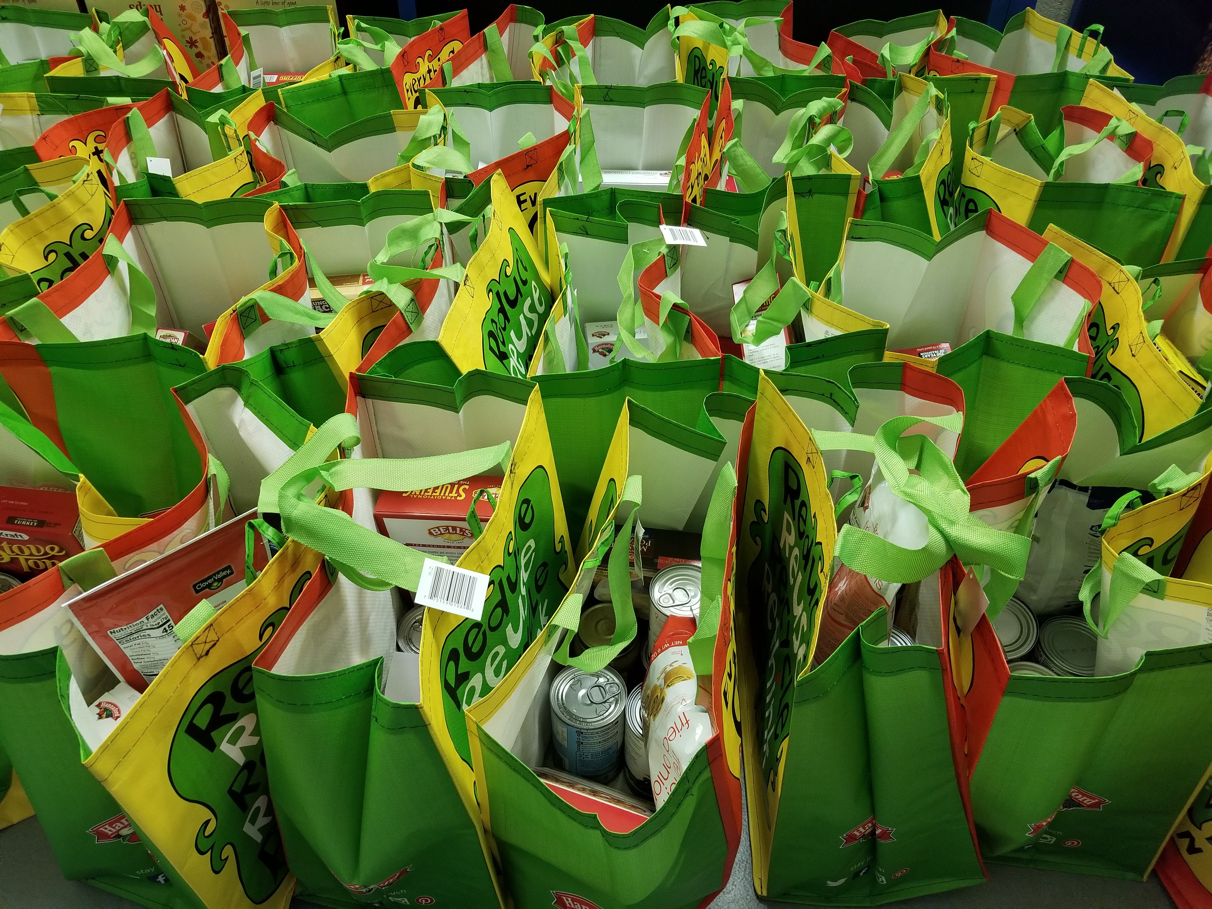 Reusable bags packed with food items.